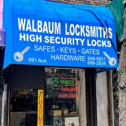 Walbaum Locksmiths - Our bright blue awning sign at 991 1st Ave.