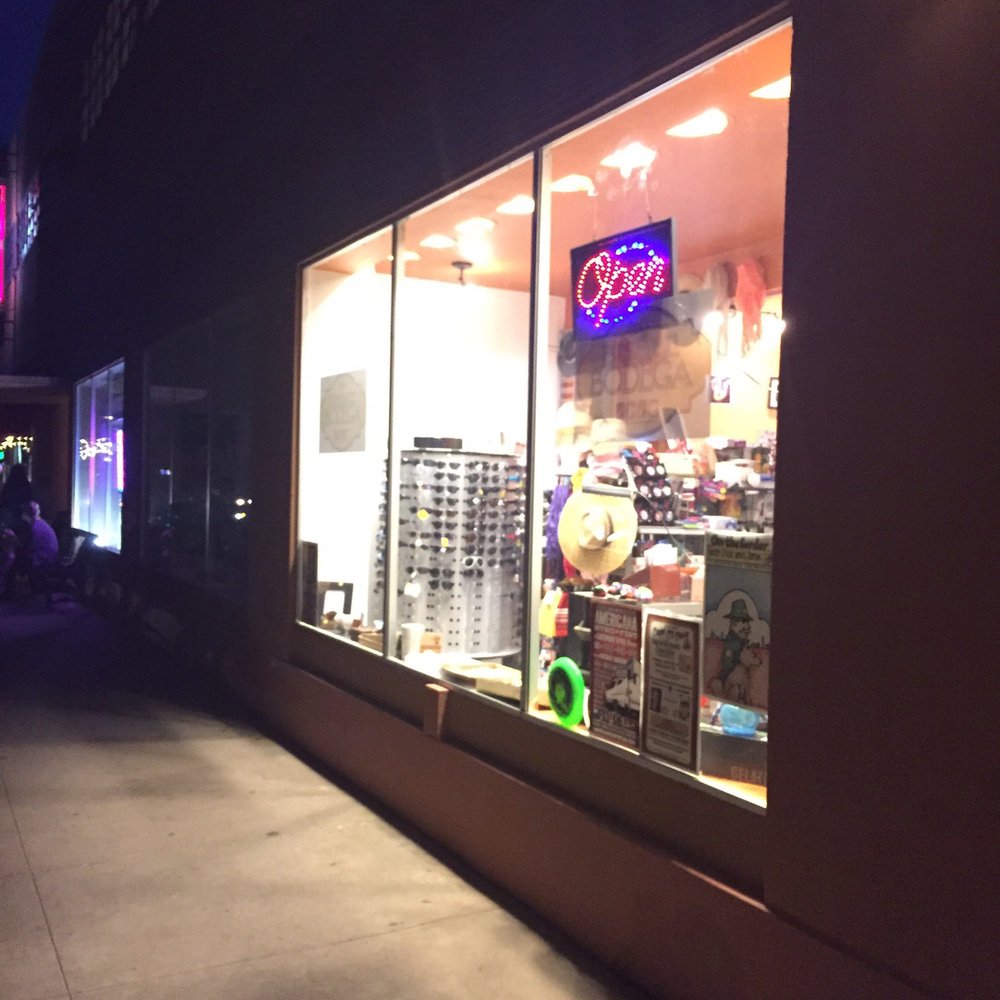 By the Table Restaurant with entrance inside shared plaza. Bisbee small groceries.