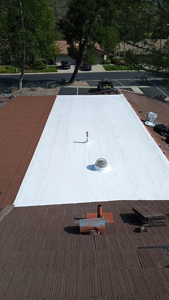 Slide of Tello's Roofing