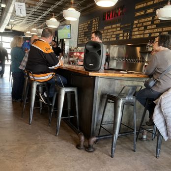 Brink Brewing - a group of people sitting at a bar - Breweries Near Me - Cincinnati, Ohio