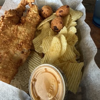 Bud's Tavern - Fish sandwich with chips and a side of hush puppies. - American Near Me - Louisville, Kentucky Bud's Tavern - Fish sandwich with chips and a side of hush puppies. - American Near Me - Louisville, Kentucky