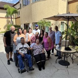 Hawthorne Health and Rehab of Sarasota - Family all visiting out in the courtyard
