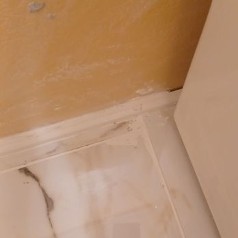Big Country Home Improvements - Thin set on wall tried to and grout on wall corner chipped off and he tried to cover it up - General Contractors Near Me - Abingdon, Virginia Big Country Home Improvements - Thin set on wall tried to and grout on wall corner chipped off and he tried to cover it up - General Contractors Near Me - Abingdon, Virginia