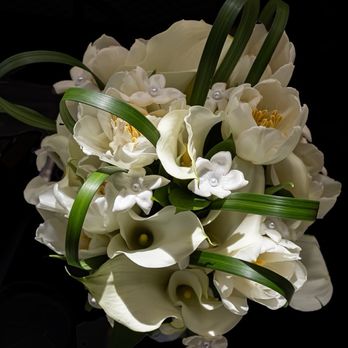 Four Seasons Flowers - Brides bouquet, tulips, calla Lilly, looped bear grass. Even included pearl details in the flowers - Florists Near Me - San Diego, California