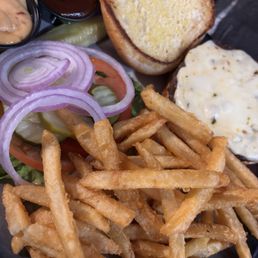 Burger with pepper Jack cheese. They spoke my love la Gauge having pickles on the burger AMD giving me a pickle spear