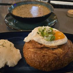 Bacowka - Żurek (white borscht) in a bread bowl with fried egg. Seriously, one of the tastiest soups in the world.