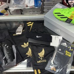 Soccer Shot Store - Clothing set that came with jersey, shorts, & socks. Also purchased shin guards, cleats, & a headband.