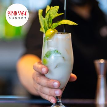 Sushi Sake Sunset - a person holding a cocktail - Asian Fusion Near Me - Miami, Florida Sushi Sake Sunset - a person holding a cocktail - Asian Fusion Near Me - Miami, Florida