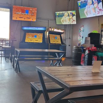 Cidercade Dallas - Another picture from our view. Straight ahead there's also outside seating with swing chairs. - Cideries Near Me - Dallas, Texas