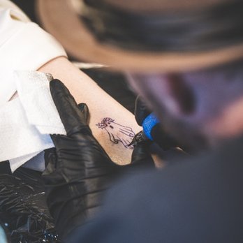Driftwood Tattoo & Piercing Studio - My (now wife) and I got matching ghost ankle tattoos.  This was such a fun moment, done before the ceremony. - Tattoo Near Me - Estes Park, Colorado
