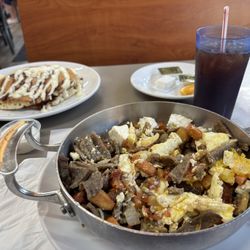 QC Coffee and Pancake House - Greek skillet with cinnamon roll pancakes! Epic!