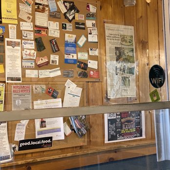 Thrive Diner - a large bulletin board with many items on it - Vegan Near Me - Pittsfield, Massachusetts