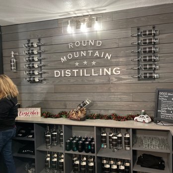 Round Mountain Distilling - a woman standing in front of a counter - Distilleries Near Me - Round Mountain, Texas Round Mountain Distilling - a woman standing in front of a counter - Distilleries Near Me - Round Mountain, Texas