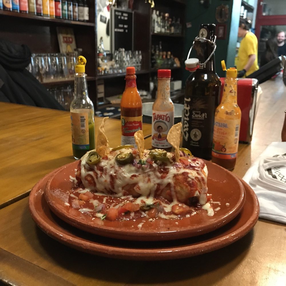 Jim Burrito - Enchilada with tomatoes cheese souce - Mexican Near Me - Hamburg, HH Jim Burrito - Enchilada with tomatoes cheese souce - Mexican Near Me - Hamburg, HH