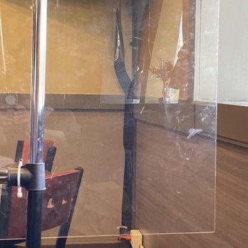 Brass Monkey - a man standing in a glass walled room - Bars Near Me - Providence, Rhode Island