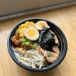 a bowl of ramen noodles with a boiled egg