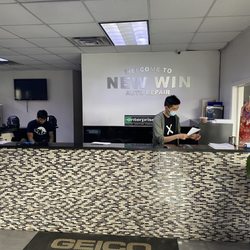 New Win Auto Repair - Front desk with Michael in X T-shirt