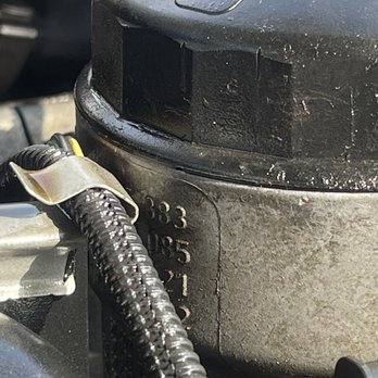 Zeigler ford - Filter housing cap with chunk missing above the "3" - Car Dealers Near Me - North Riverside, Illinois Zeigler ford - Filter housing cap with chunk missing above the "3" - Car Dealers Near Me - North Riverside, Illinois