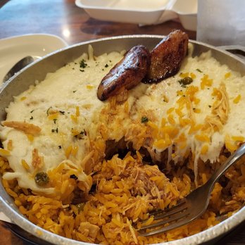 Old Cuban Cafe - Royal Rice: yellow rice with chicken.  Thick layet of cheese and fried plaintains - Cafes Near Me - Orlando, Florida