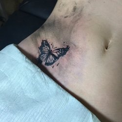 Brass Rabbit Tattoo - Tommy took 2 pictures I had and created something original. He takes his work very seriously!