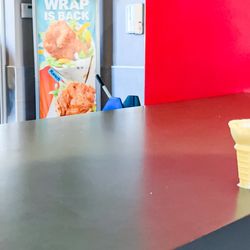 McDonald's - Messy counter with the melted ice cream and the condiments. Also, I spy an employee unaware of the mess.