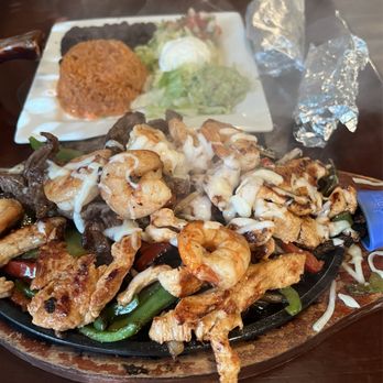 M’Xuma - Triple fajitas with shrimp, steak, and chicken. Enough for two to share. - Tacos Near Me - Babcock Ranch, Florida