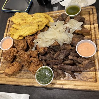 Metropol Restaurant & Bar - Sampler Criollo (fried diced pork, chopped skirt steak, fried diced chicken, fried plantains) - Puerto Rican Near Me - Miami, Florida Metropol Restaurant & Bar - Sampler Criollo (fried diced pork, chopped skirt steak, fried diced chicken, fried plantains) - Puerto Rican Near Me - Miami, Florida