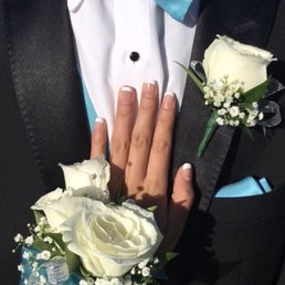 White roses with light blue and silver ribbon, baby's breath, and diamond accents (which are included!)