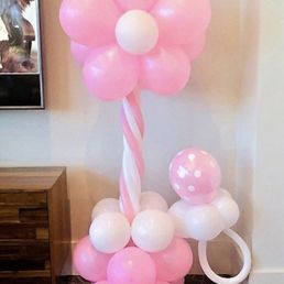 Baby shower "Flower balloon tower with pacifier" arrangement by Jax Party.