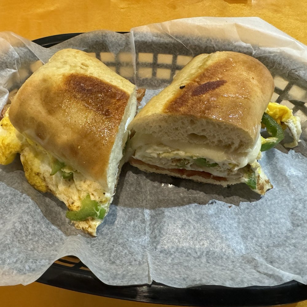 Breakfast Sandwich (Eggs, Bacon, Onions, Green Peppers, Provolone on French Bread) Breakfast Sandwich (Eggs, Bacon, Onions, Green Peppers, Provolone on French Bread)