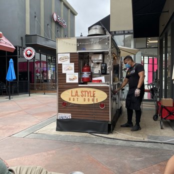 LA Style Hotdogs - a man standing in front of a food cart - Hot Dogs Near Me - Orange, California LA Style Hotdogs - a man standing in front of a food cart - Hot Dogs Near Me - Orange, California