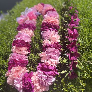 Edstraordinary Lei & Flowers - Double carnation lei (three colors) and an orchid lei po'o/haku lei (crown lei). - Floral Designers Near Me Edstraordinary Lei & Flowers - Double carnation lei (three colors) and an orchid lei po'o/haku lei (crown lei). - Floral Designers Near Me