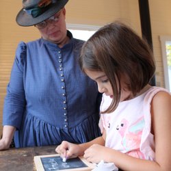 Louisa County Historical Society - Children learn about education in the late 19th century when they visit the schoolhouse at the Louisa County Historical Society
