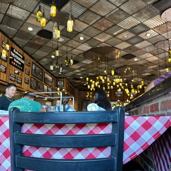 Grimaldi's Pizzeria - people sitting at a table - Pizza Near Me - El Paso, Texas