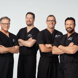 Oral & Maxillofacial Associates - Our Surgeons - (Left to Right) Dr. Scott Searcey, Dr. Drew Wendelken, Dr. Ross Martin, and Dr. Tracy McIntire