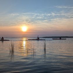 Coastal Explorations - Kayakers and Currituck Sound in a lavender sunset
