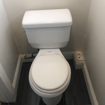 Dion's Construction - a toilet in a small bathroom - General Contractors Near Me Dion's Construction - a toilet in a small bathroom - General Contractors Near Me