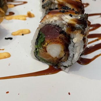 Six Happiness - a sushi roll on a white plate - Asian Fusion Near Me - Leland, North Carolina