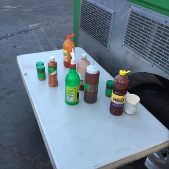 La Fruti Fresca - a table with condiments on it - Food Trucks Near Me - Oxnard, California La Fruti Fresca - a table with condiments on it - Food Trucks Near Me - Oxnard, California