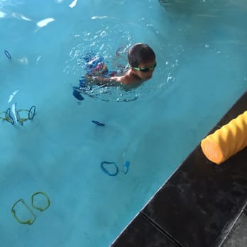 All Waves Aquatics - Swimming for rings at the end of his lesson - Swimming Lessons/Schools Near Me - Huntington Beach, California All Waves Aquatics - Swimming for rings at the end of his lesson - Swimming Lessons/Schools Near Me - Huntington Beach, California
