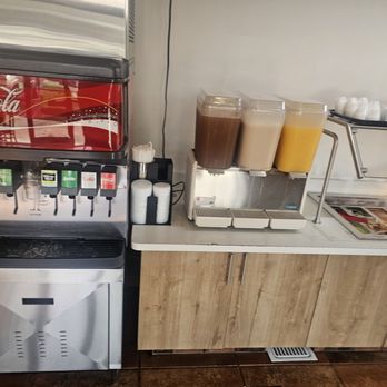 Jalisco Grill - Self serve drink station horchata in the middle and my new favorite melon drink on the right. - Mexican Near Me - Roseville, California