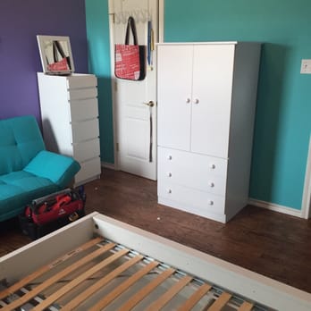 Assemblexs - a bedroom with a futon and a bed - General Contractors Near Me