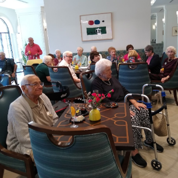 Windsor at Celebration - One of the regular gatherings at the Windsor.  This was a birthday party for one of the residents. - Retirement Homes Near Me - Celebration, Florida