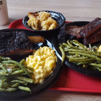 Killen's Barbecue - Left: beef rib with green beans and mac and cheese. Right: pork rib and brisket with green beans and mac and cheese. Back: bread pudding. - Barbeque Near Me - Pearland, Texas
