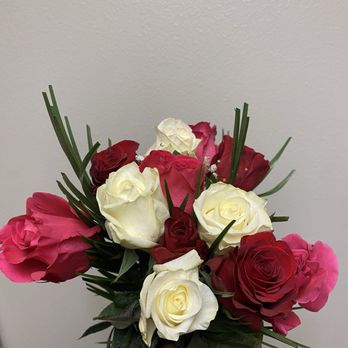 Edible Arrangements - a hand holding a bouquet of roses - Gift Shops Near Me - Westminster, California
