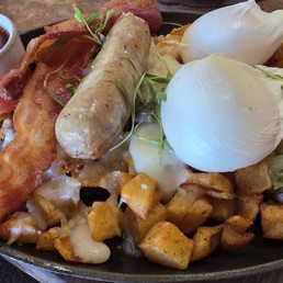 The breakfast skillet was good, with poached eggs, bacon and sausage, on top of diced potatoes with melted cheese. The breakfast skillet was good, with poached eggs, bacon and sausage, on top of diced potatoes with melted cheese.
