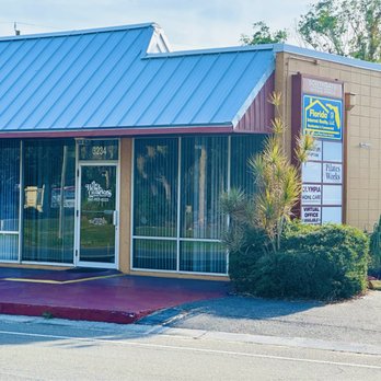 Headquarters - The outside with plenty of parking to the left. - Hair Salons Near Me - Sarasota, Florida