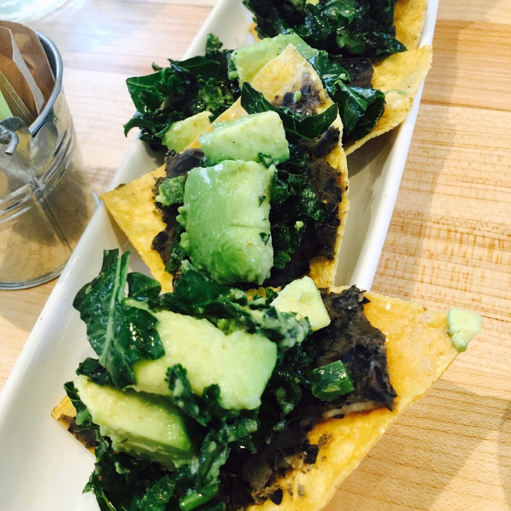Vinaigrette - BLACK BEAN & KALE NACHOS with avocado and cilantro cream, fresh tortilla chips - Salad Near Me - Austin, Texas Vinaigrette - BLACK BEAN & KALE NACHOS with avocado and cilantro cream, fresh tortilla chips - Salad Near Me - Austin, Texas