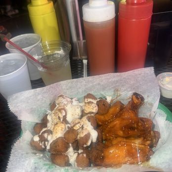 Munchies on 5th Bar & Grille - Party wings flavored hot honey with Cajun ranch okra - Cocktail Bars Near Me - Birmingham, Alabama