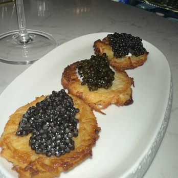 Number One Caviar Boutique - Potato pancakes showcasing 3 different types caviar including; White Sturgeon Caviar, Osetra Classic Caviar & one other I can't remember - Seafood Markets Near Me - New York, New York Number One Caviar Boutique - Potato pancakes showcasing 3 different types caviar including; White Sturgeon Caviar, Osetra Classic Caviar & one other I can't remember - Seafood Markets Near Me - New York, New York